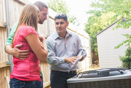 couple talking to  a service tech
